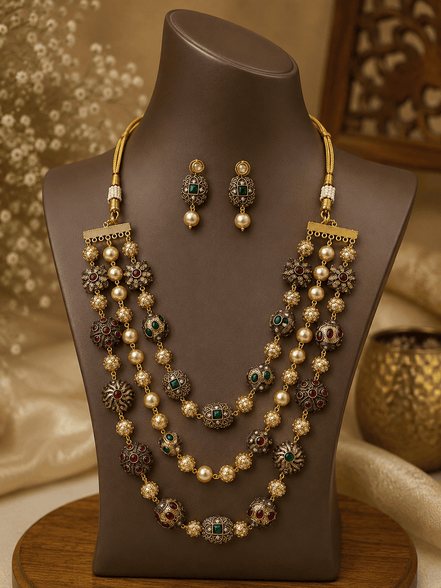 Gold-tone mala necklace set with green stones and pearls, with vertical drop earrings