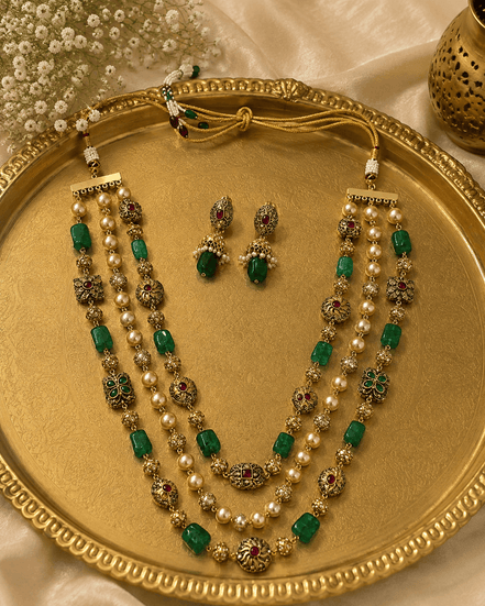 Gold-tone 3-layer mala necklace with green stones and pearls, plus stud earrings