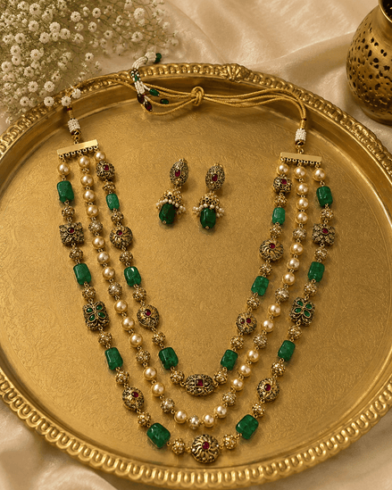 Gold-tone 3-layer mala necklace with green stones and pearls, plus stud earrings