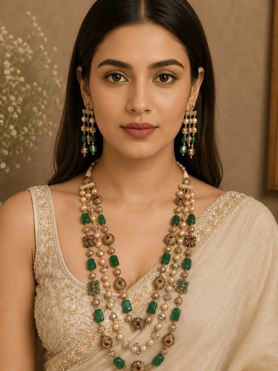 Gold-tone mala necklace with green stone clusters, pearl drops, and dangling earrings