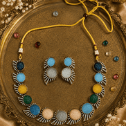 Multicolor beaded stone necklace set with matching earrings, gold-tone accents