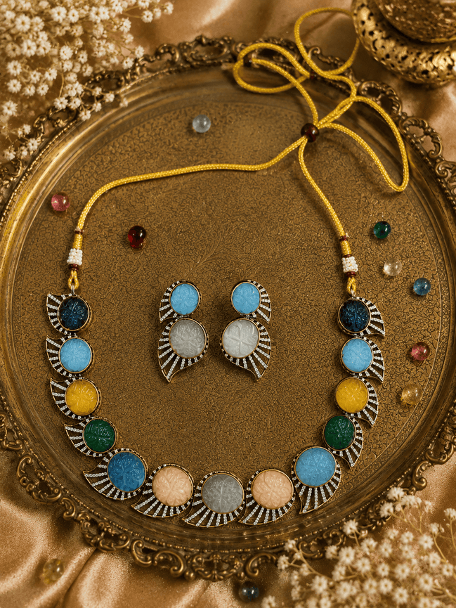 Multicolor beaded stone necklace set with matching earrings, gold-tone accents