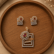 Gold-tone ruby red pendant and stud earring set with square lattice and halo stones