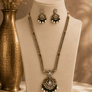 Gold-tone necklace set with emerald-green beaded pendant and matching stud drop earrings