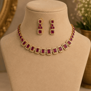 Gold-tone necklace with red and green square stones and matching stud earrings