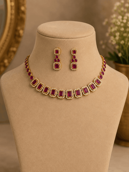 Gold-tone necklace with red and green square stones and matching stud earrings