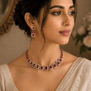 Gold-tone necklace with red and green gemstone squares and matching stud earrings