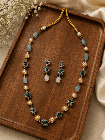 Gold-tone mala necklace with teal square charms and matching stud earrings, set