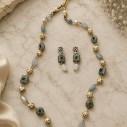 Gold-tone mala necklace with teal beads and matching double-drop earrings, set
