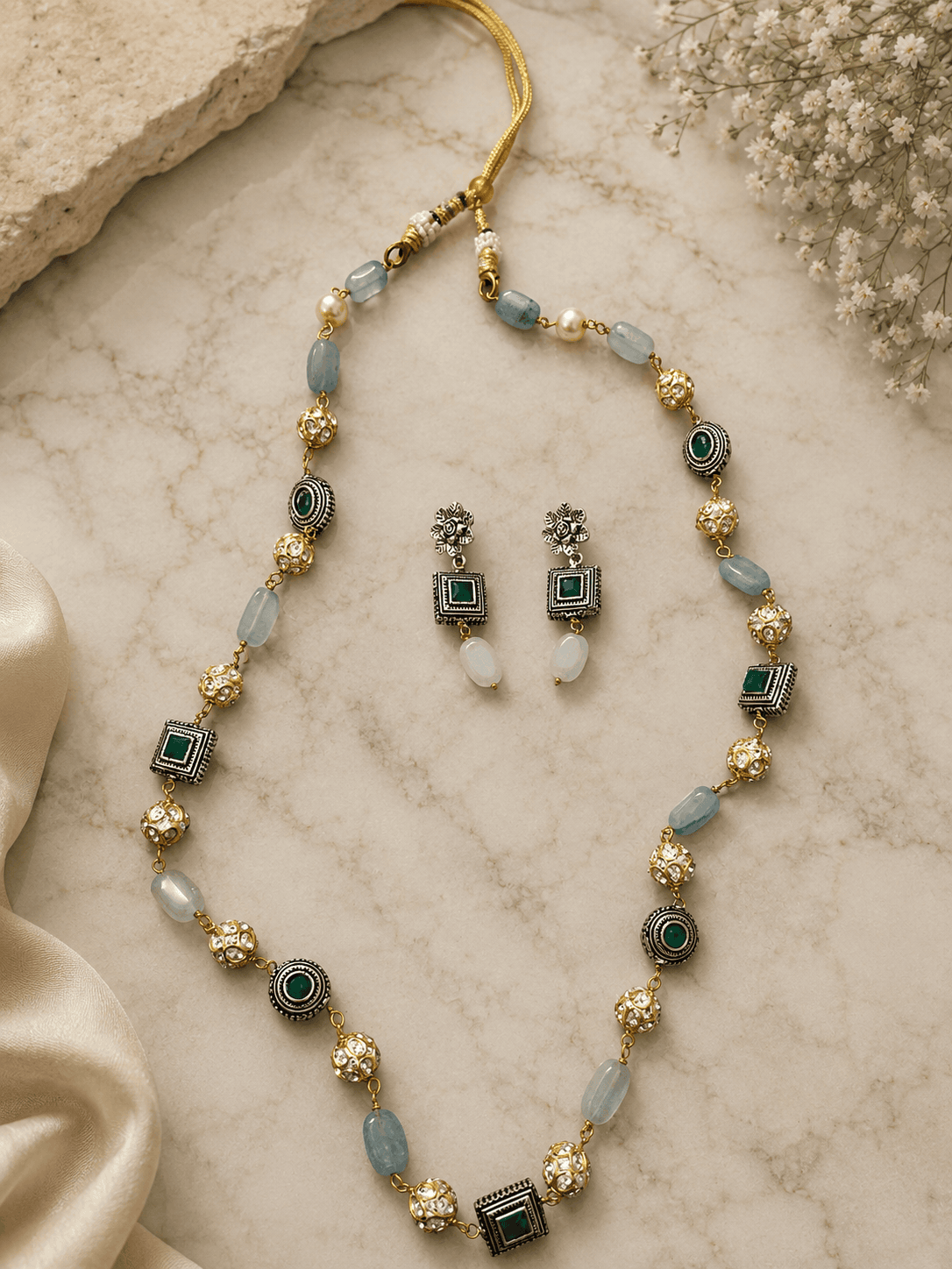 Gold-tone mala necklace with teal beads and matching double-drop earrings, set
