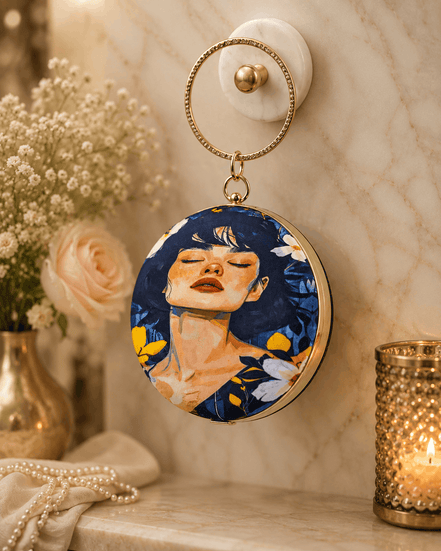 Round blue illustrated clutch bag with gold-tone chain, portrait front and hook clasp