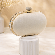 Cream fabric clutch with multicolor beaded edge and gold-tone top clasp