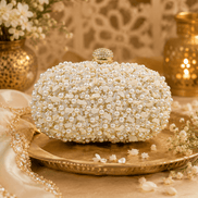 Cream-white pearl beaded clutch with gold-tone top clasp and beaded rows