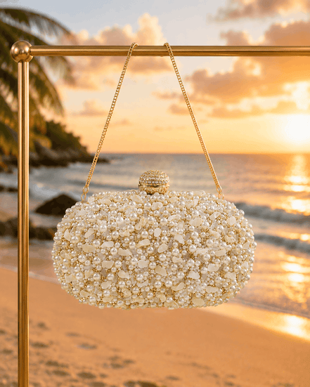 White pearl beaded oval clutch with gold-tone top clasp and hanging chain
