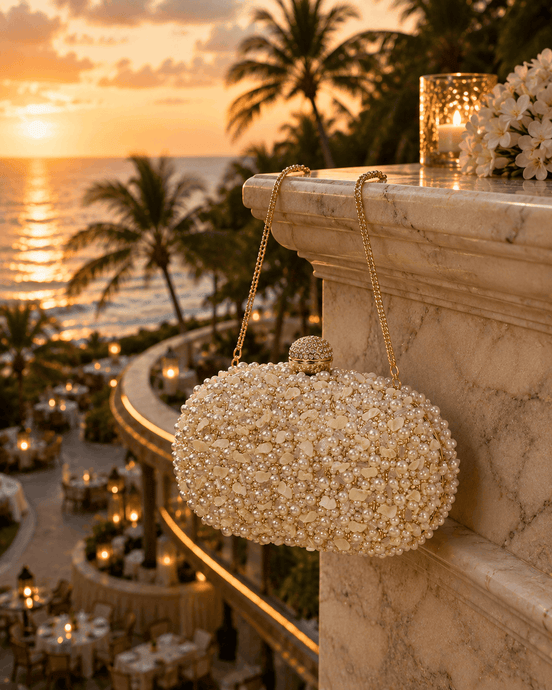 White pearl beaded clutch with gold-tone top clasp and long gold chain handle