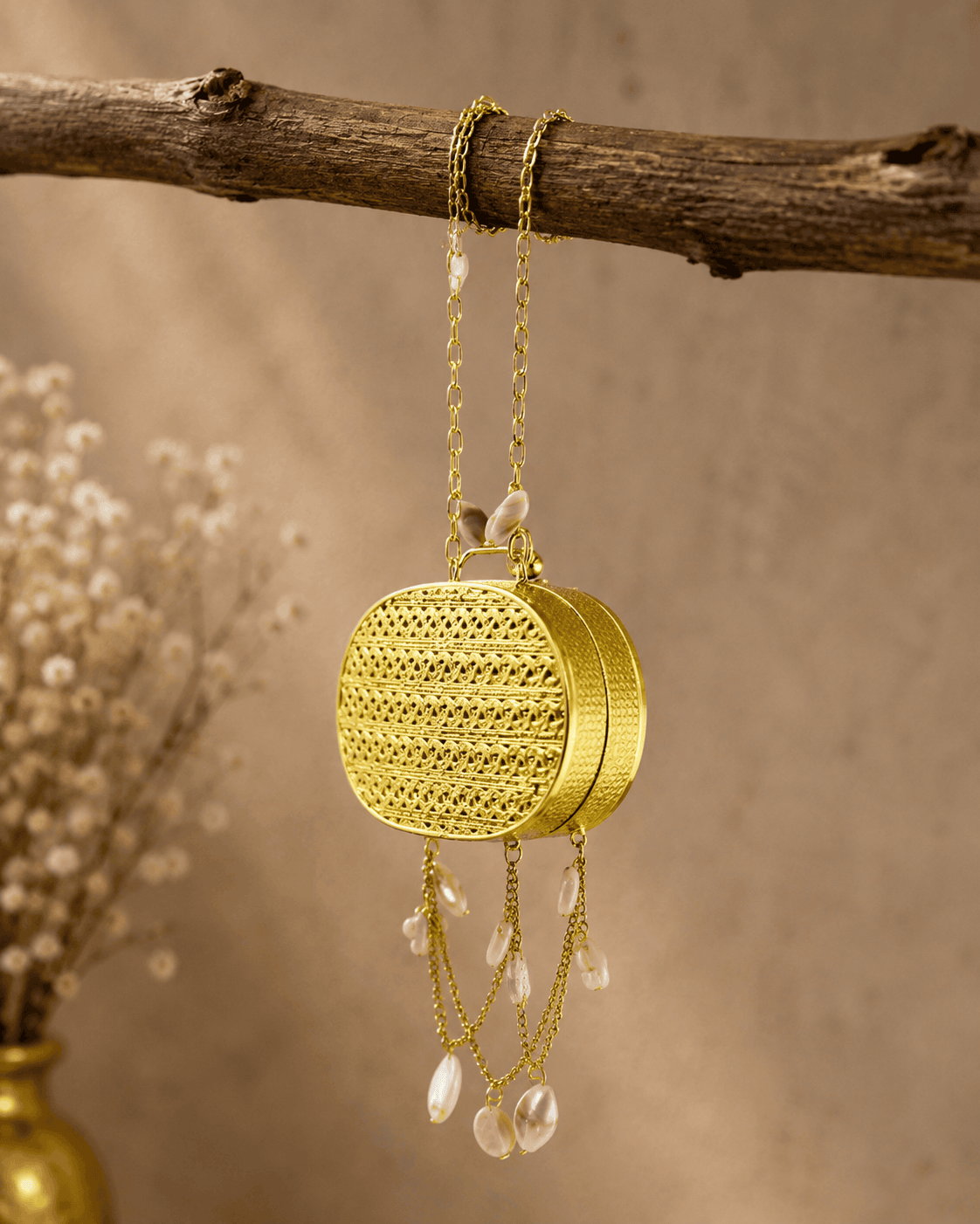Gold round mesh clutch with pearl tassels and long chain handle