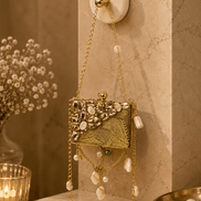 Gold beaded rectangular clutch bag with textured panel, pearl drops, and long chain