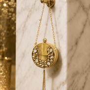 Gold round beaded clutch with pearl tassel chain and textured front panel