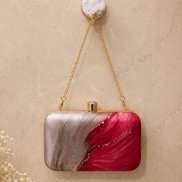 Alora clutch with gold chain strap, gold clasp top, pink and red marble print.