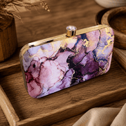 Alora clutch with gold-tone frame and clasp, plum purple and pink marble print.