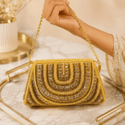 Gold beaded shoulder bag with ornate arched front and fringe bead trim