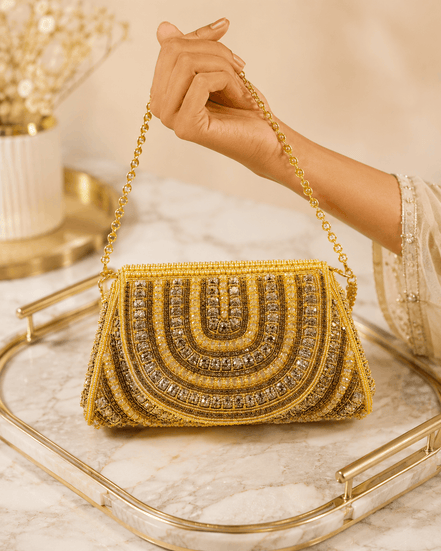 Gold beaded shoulder bag with ornate arched front and fringe bead trim