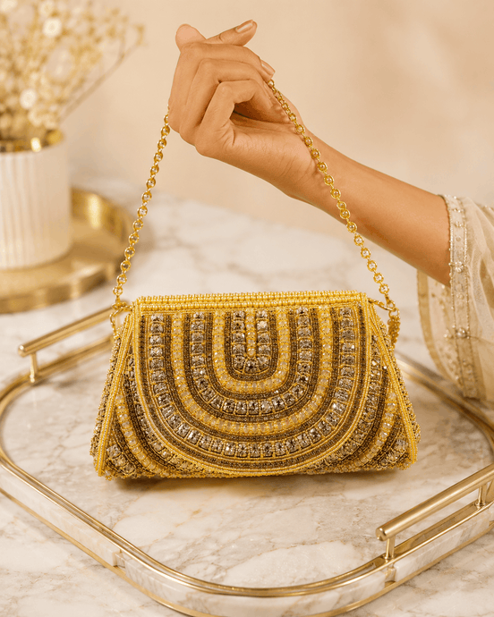 Gold beaded shoulder bag with ornate arched front and fringe bead trim