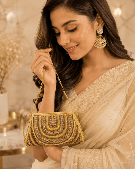 Gold beaded shoulder bag with scalloped arched design and dangling chain strap