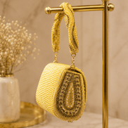 Gold beaded shoulder bag hanging on display stand, arched front with beadwork