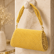 Gold beaded cylindrical shoulder bag with chain handle and tassel fringe