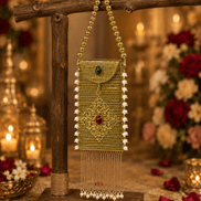 Gold filigree mobile clutch with beaded tassel fringe and green/red gem details