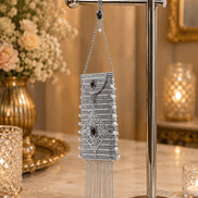 Silver filigree mobile clutch hanging with chain strap and purple oval centerpiece