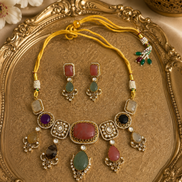 Kundan necklace set with gold-tone chain, multicolor stones, matching drop earrings