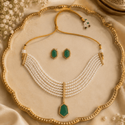 Gold-tone pearl necklace set with green drop pendant and matching stud earrings