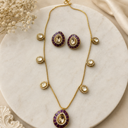 Gold-tone necklace and earring set with round purple center medallions and crystal accents