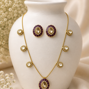 Gold-tone jewelry set: Y necklace with round medallions and matching stud earrings