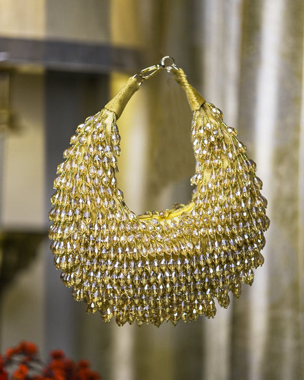 Gold crystal hobo bag with mesh fringe and loop top handles