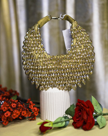 Gold crystal hobo bag with rounded mesh fringe and metal loop handle
