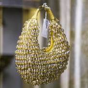 Gold crystal hobo bag, side view, mesh beaded fringe with hanging tag