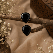 Black teardrop stud earrings with glossy faceted stones