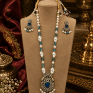 Beaded mala set with blue beads, gold teardrop earrings, and blue center pendant