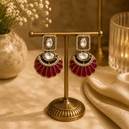 Gold-tone drop earrings with maroon enamel fan dangles and oval crystal centers