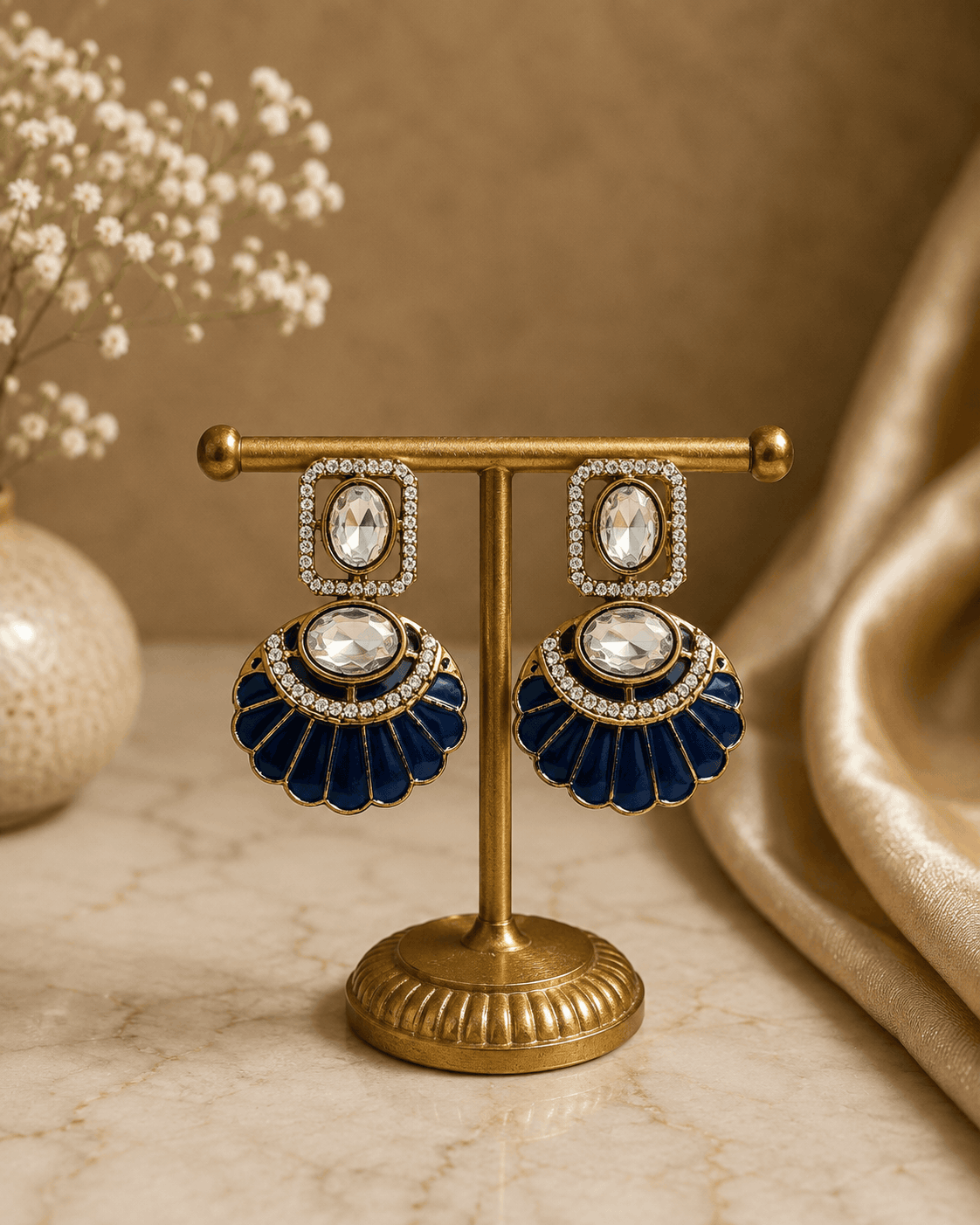 Gold-tone fan statement earrings with oval crystals and navy enamel scalloped petals
