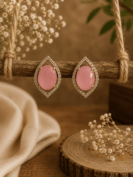 Pink teardrop halo stud earrings with pavé crystal border, gold-tone setting.