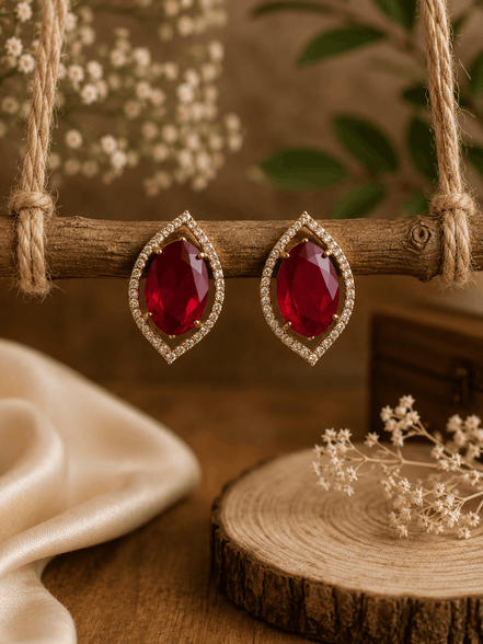 Red teardrop halo stud earrings with pavé crystal border, gold-tone setting.