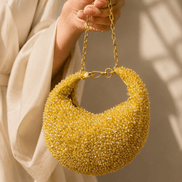 Gold crystal beaded hobo bag held by chain, teardrop shoulder style