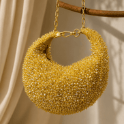 Gold crystal beaded hobo bag with gold chain and circular open frame