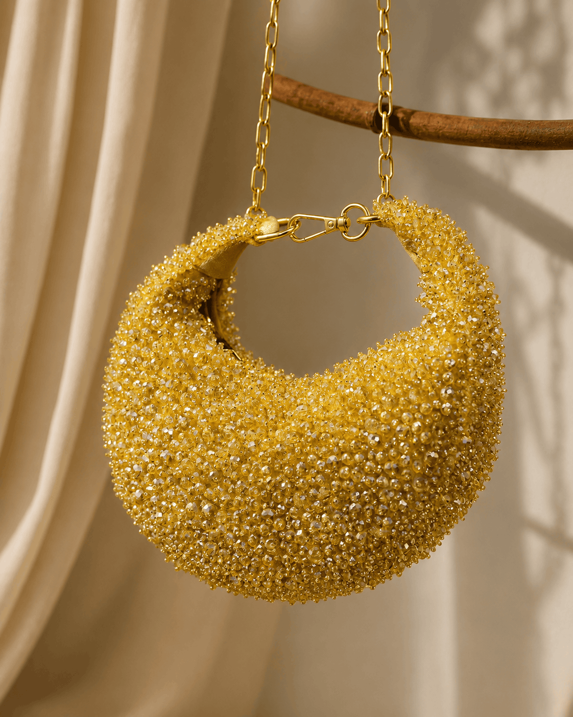 Gold crystal beaded hobo bag with gold chain and circular open frame