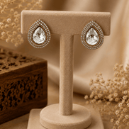 Aurelle teardrop stud earrings: gold-tone teardrop with clear crystal halo