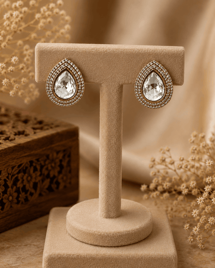 Aurelle teardrop stud earrings: gold-tone teardrop with clear crystal halo